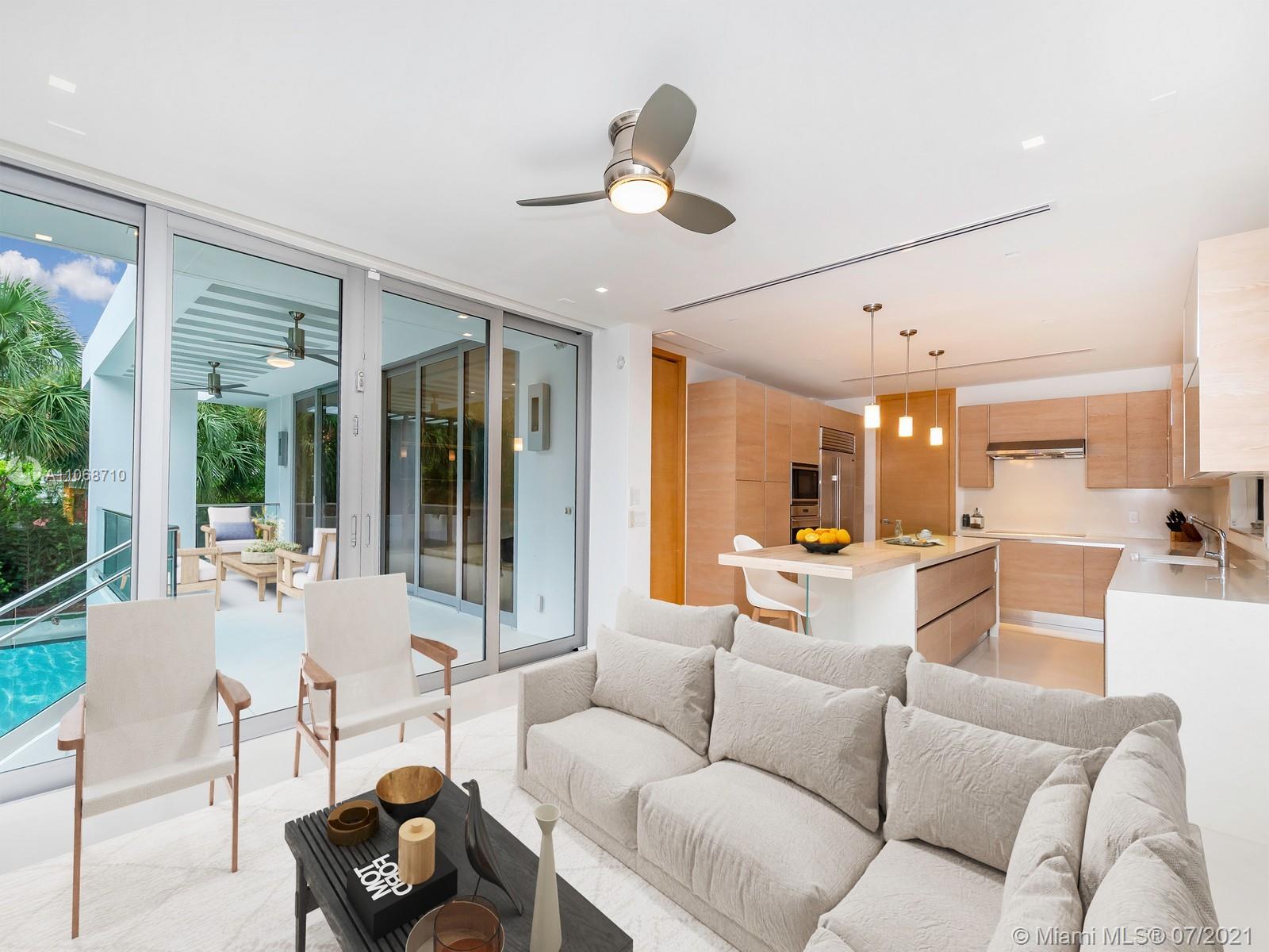 761 Glenridge Road Key Biscayne, FL 33149 - Photo 5 of 19 a living room with furniture ceiling fan and a large window