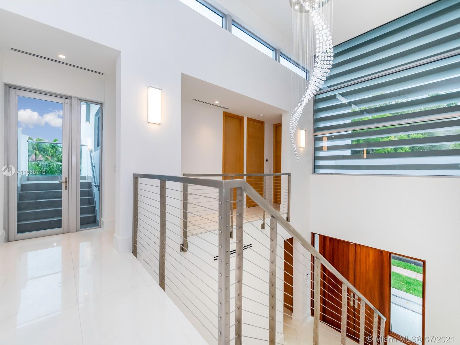 761 Glenridge Road Key Biscayne, FL 33149 - Photo 9 of 19 a view of an entryway with staircase