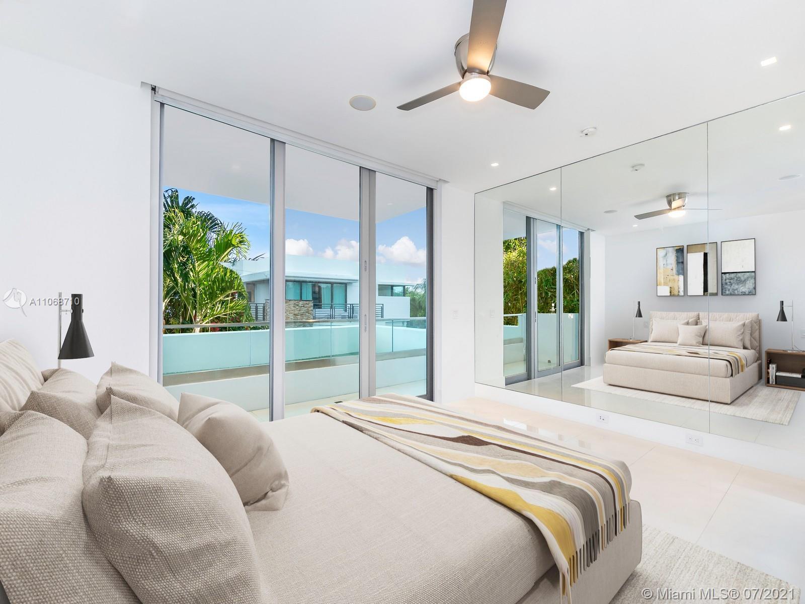 761 Glenridge Road Key Biscayne, FL 33149 - Photo 10 of 19 a spacious bedroom with a large bed and a large window