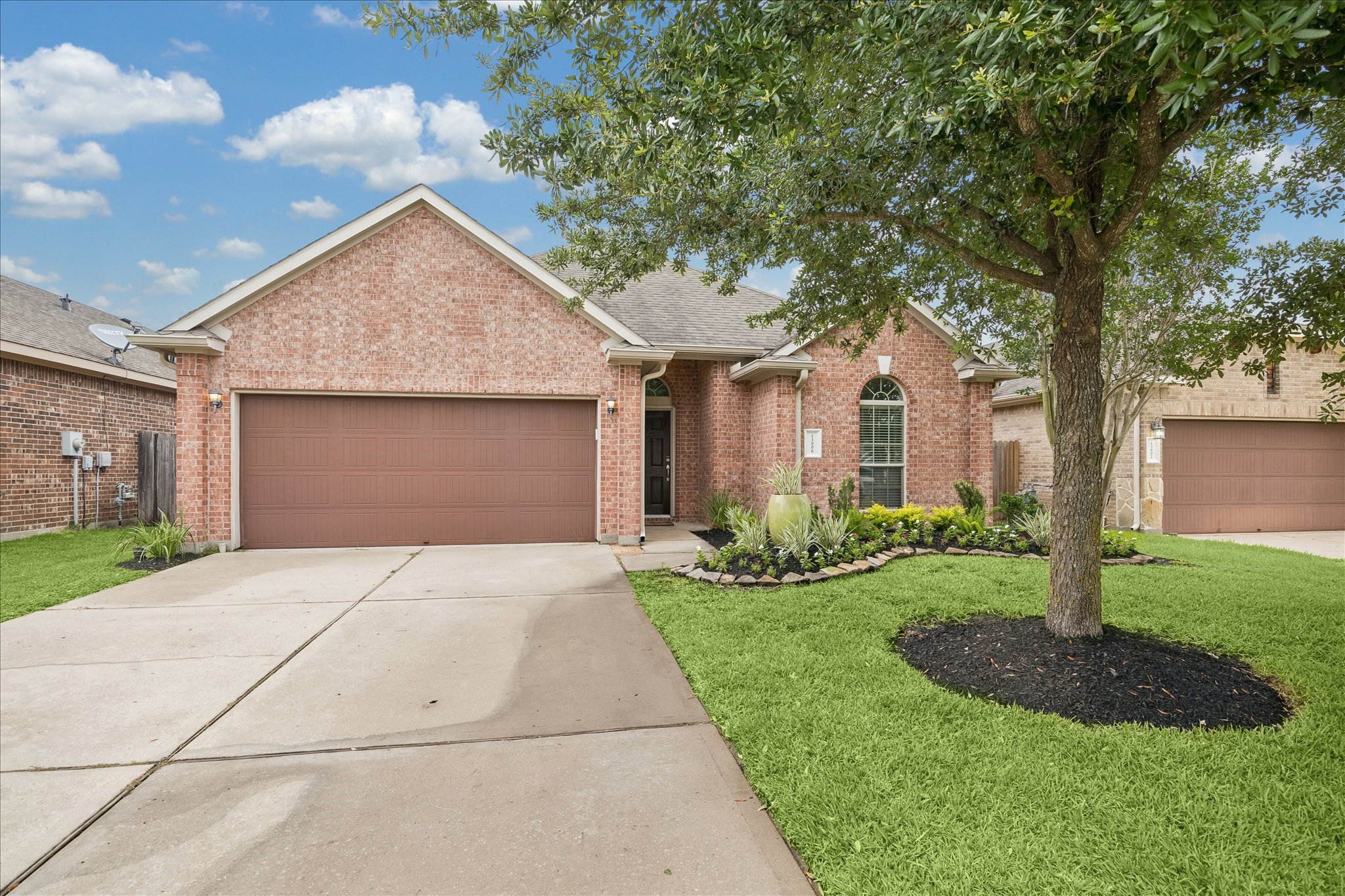 13006 Millstream Bend Lane Tomball, TX 77377 - Photo 20 of 25 a front view of a house with garden