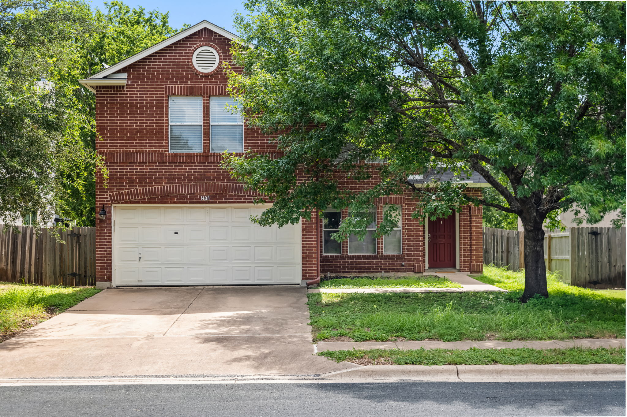 1408 Water Spaniel Way Round Rock, TX 78664 - Photo 1 of 37 A classic brick exterior offers enduring appeal with an attached garage and mature shade tree.