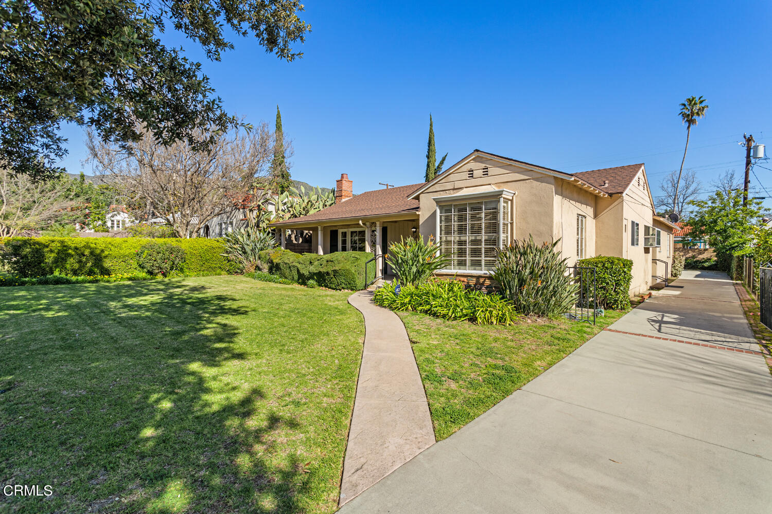 1350 Cleveland Road Glendale, CA 91202 - Photo 1 of 39 a front view of a house with garden