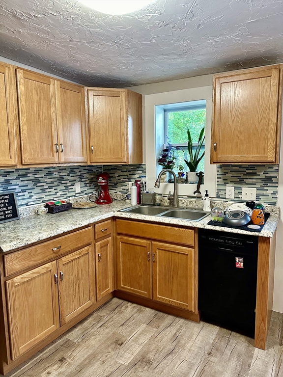 1271 Main Street Leicester, MA 01524 - Photo 12 of 23 a kitchen with stainless steel appliances granite countertop a sink stove and cabinets