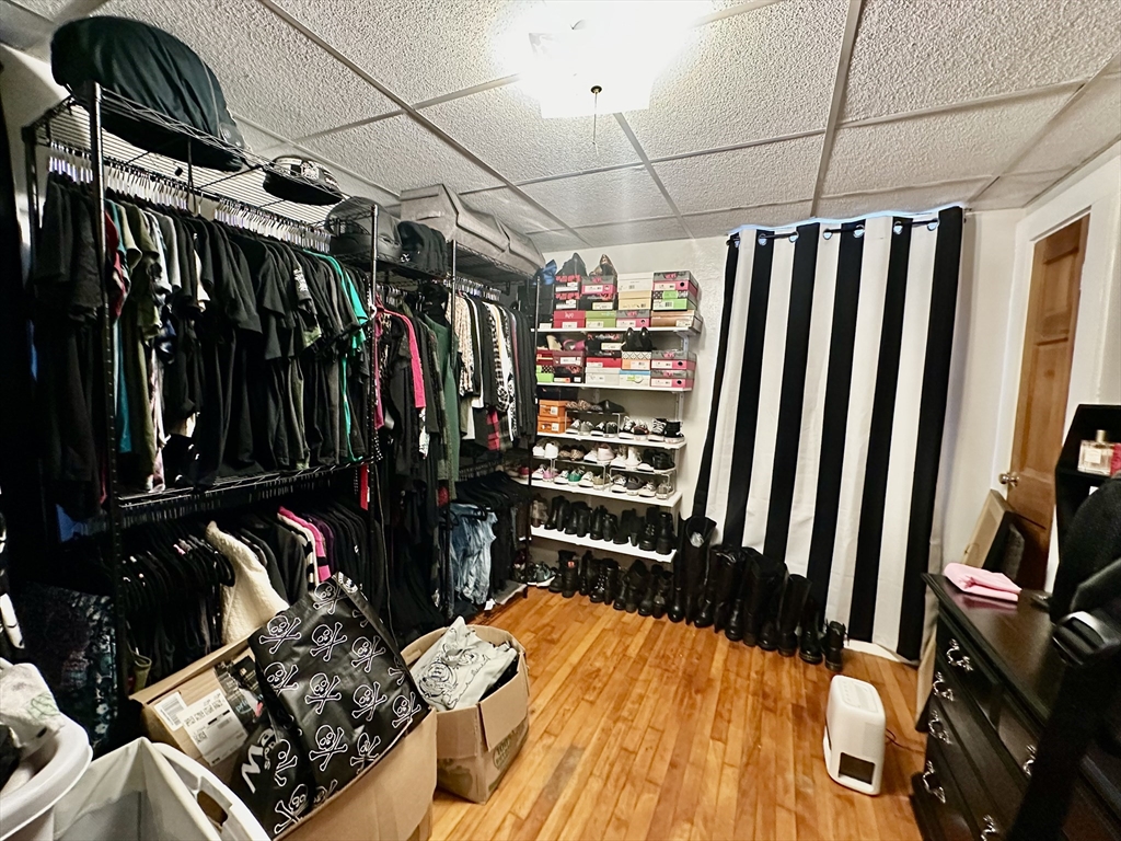 1271 Main Street Leicester, MA 01524 - Photo 14 of 23 a view of walk in closet with clothes and shoes