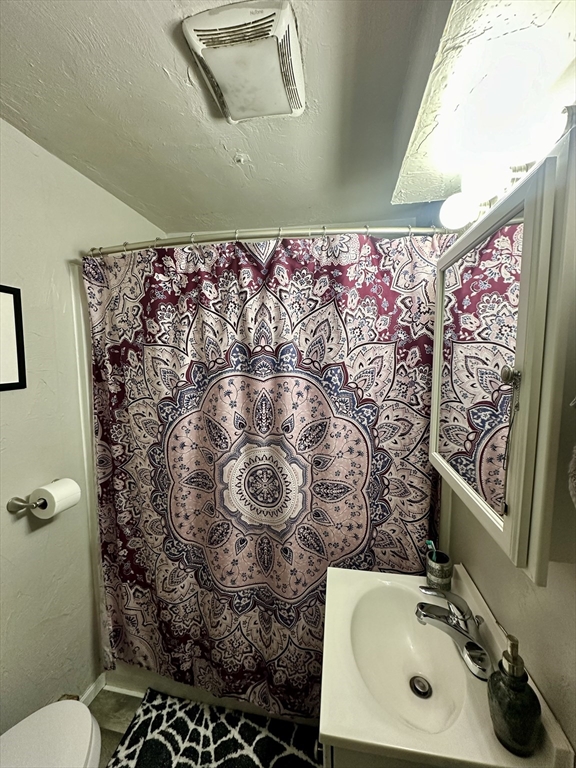 1271 Main Street Leicester, MA 01524 - Photo 16 of 23 a bathroom with a sink toilet and shower