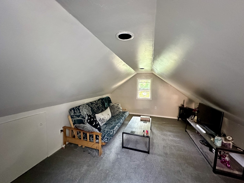 1271 Main Street Leicester, MA 01524 - Photo 21 of 23 a living room with furniture and a flat screen tv