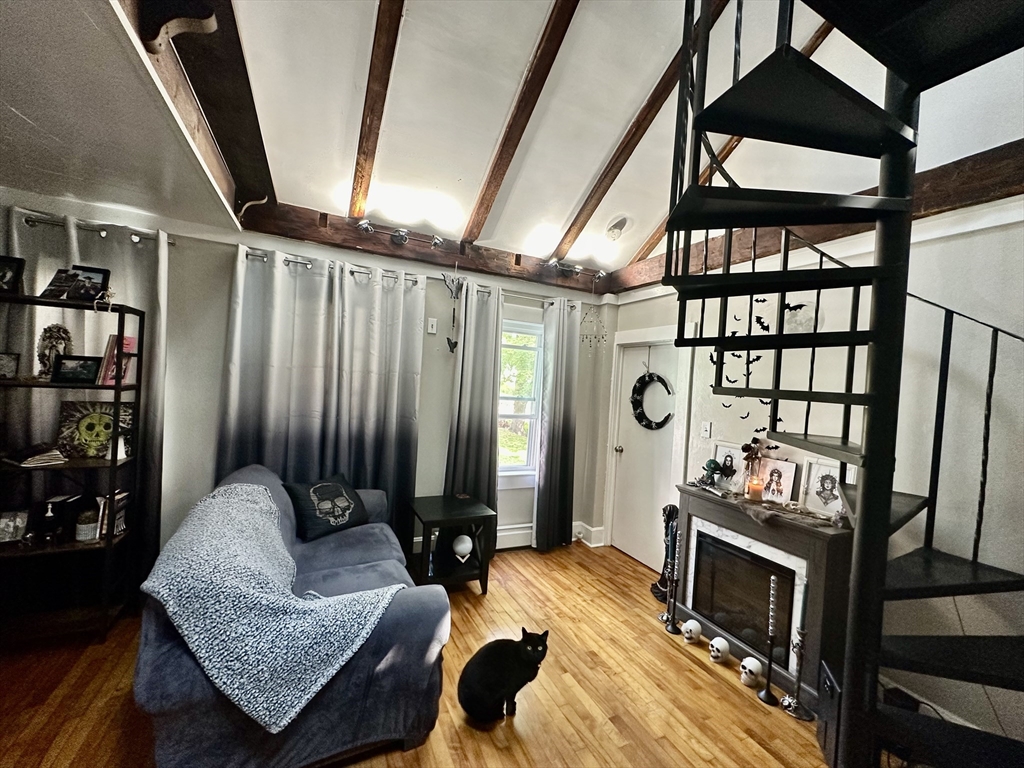 1271 Main Street Leicester, MA 01524 - Photo 23 of 23 a bedroom with furniture and a fireplace