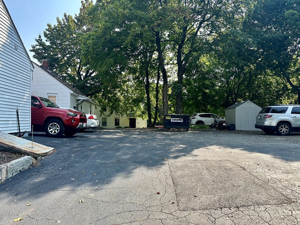 1271 Main Street Leicester, MA 01524 - Photo 8 of 23 a front view of a house with cars parked