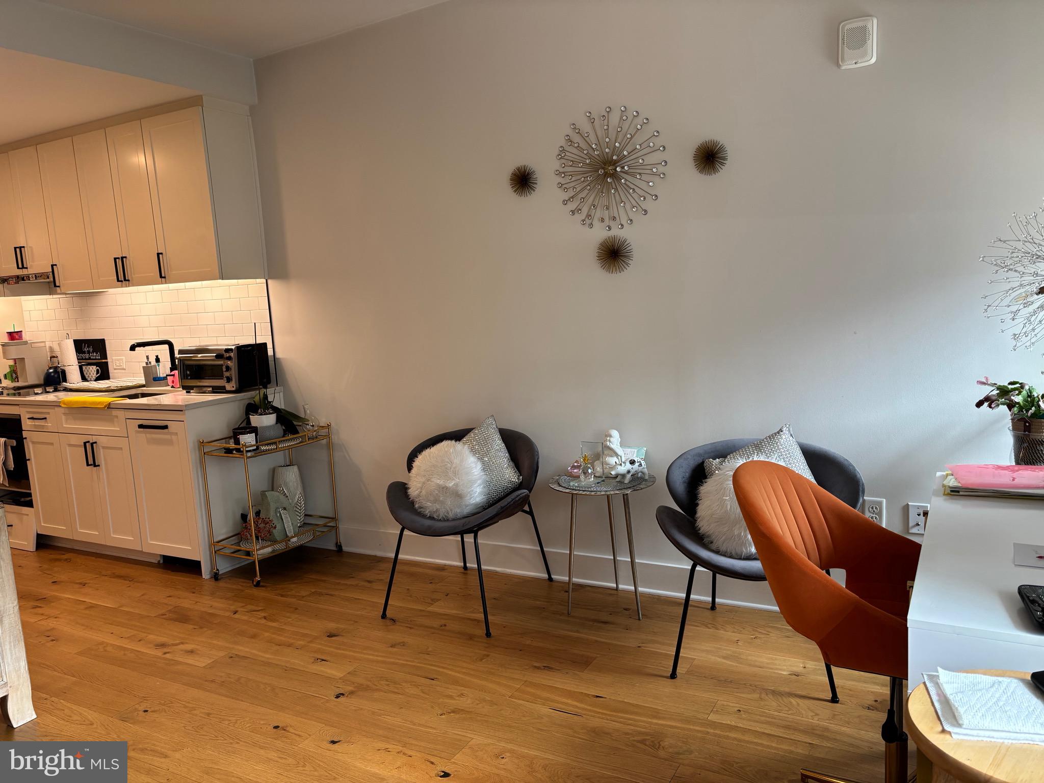 1211 Van Street Southeast, Unit 310 Washington, DC 20003 - Photo 24 of 49 a living room with furniture and a chair