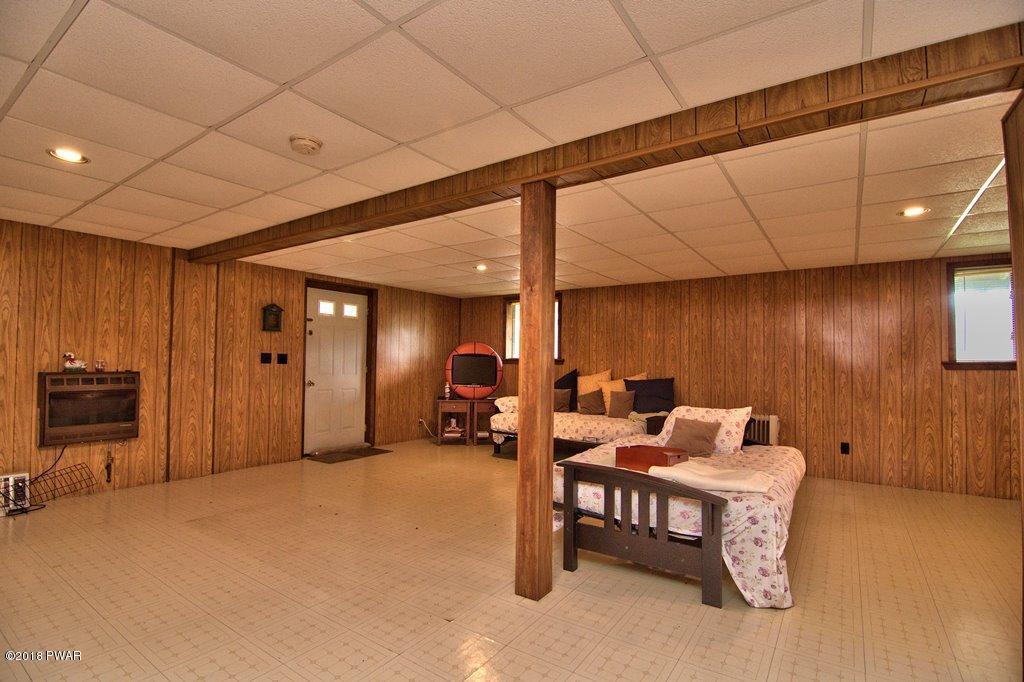 2327 Brookfield Road Lake Ariel, PA 18436 - Photo 30 of 53 a bed room with furniture and a flat screen tv
