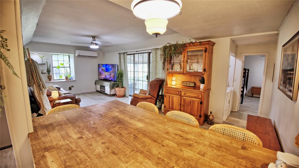 140 Elm Road Nocona, TX 76255 - Photo 7 of 26 a bedroom with furniture and a flat screen tv