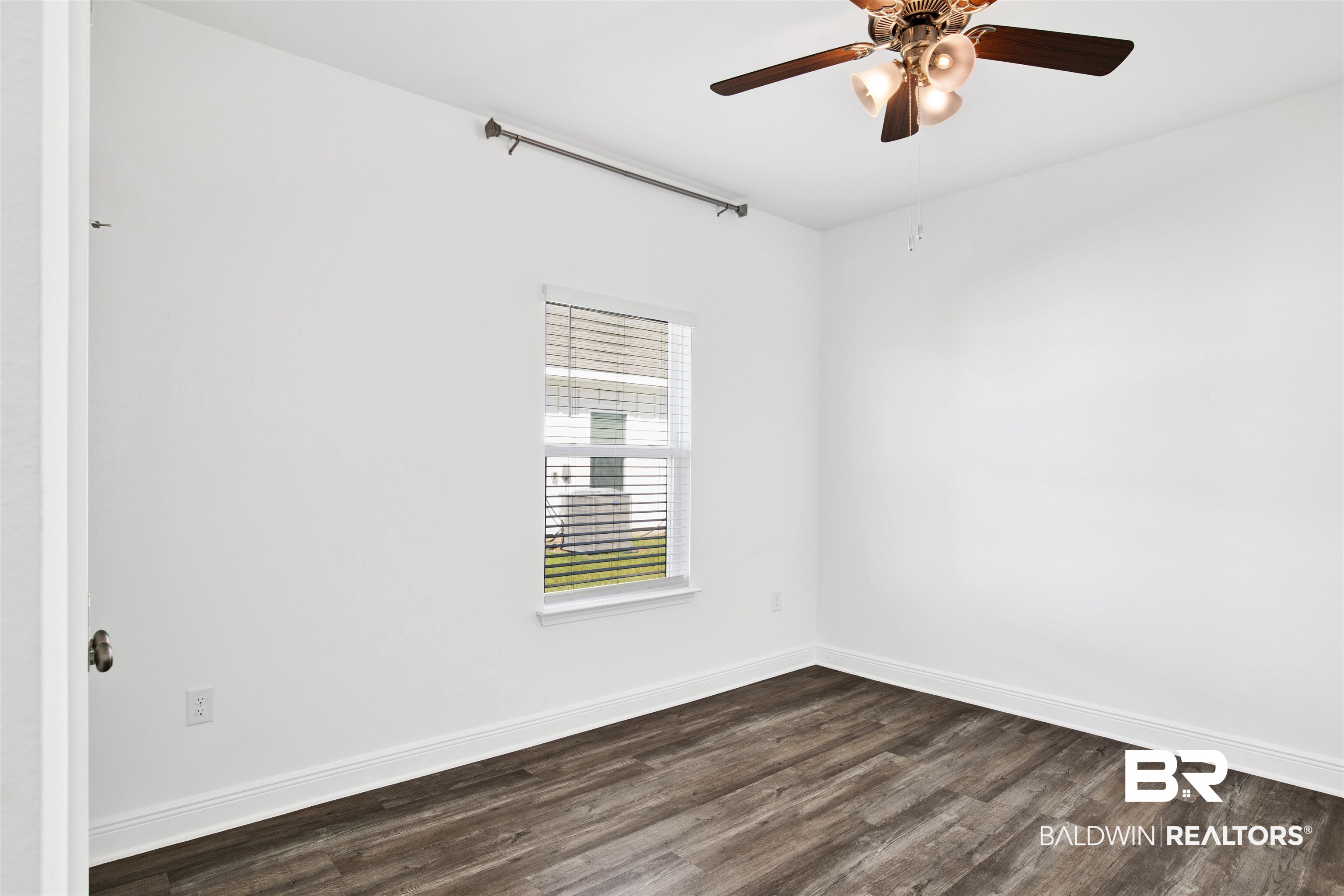 11602 Genuine Risk Circle Daphne, AL 36526 - Photo 22 of 30 Unfurnished room featuring dark wood finished floors and ceiling fan