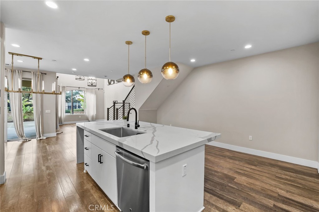 51 Prominence Lake Forest, CA 92630 - Photo 17 of 60 a kitchen with a sink and chandelier