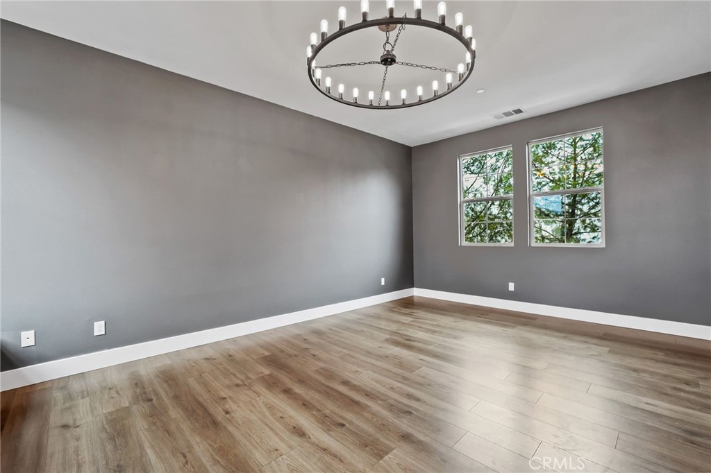 51 Prominence Lake Forest, CA 92630 - Photo 21 of 60 an empty room with a window and wooden floor