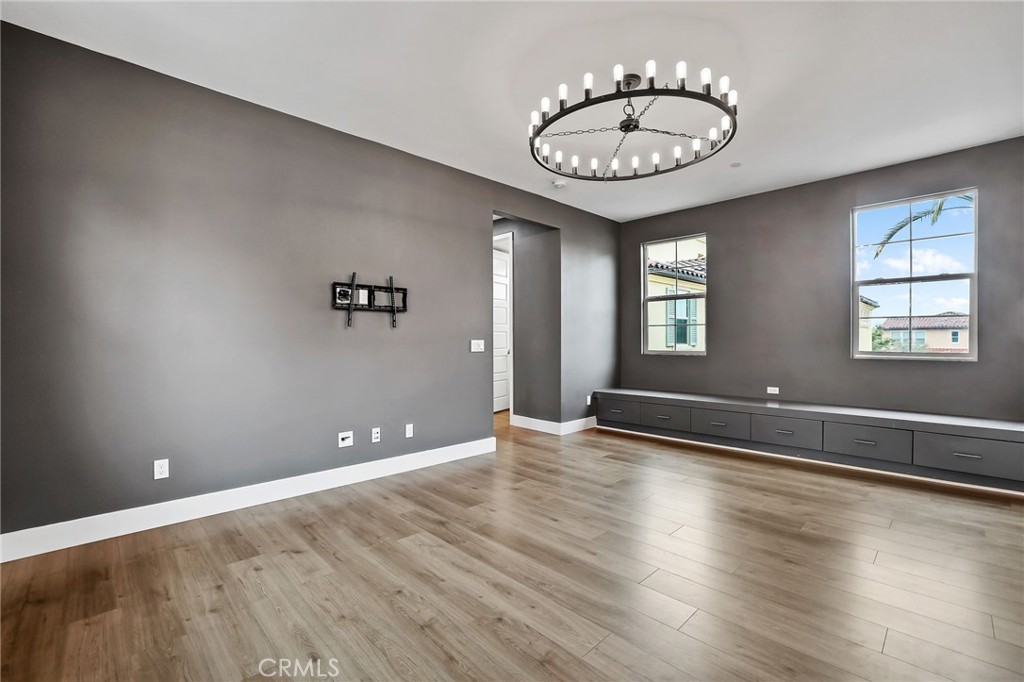 51 Prominence Lake Forest, CA 92630 - Photo 23 of 60 an empty room with wooden floor and windows