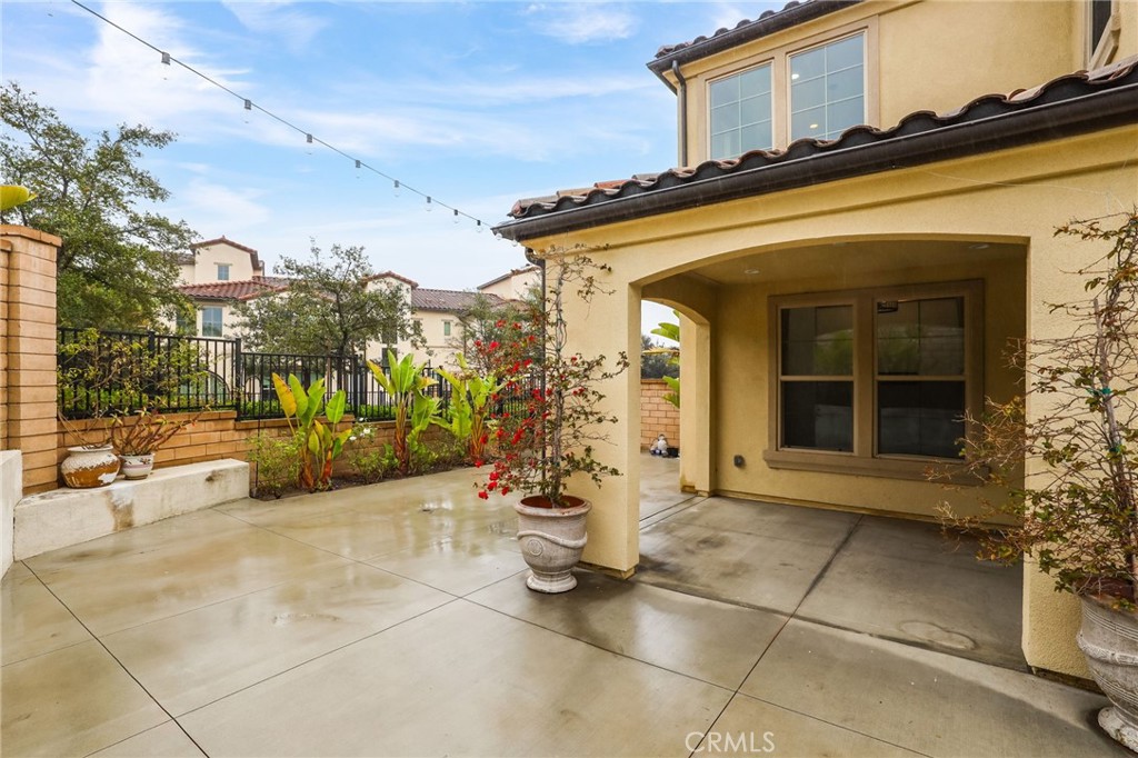 51 Prominence Lake Forest, CA 92630 - Photo 39 of 60 a view of a patio with table and chairs and potted plants