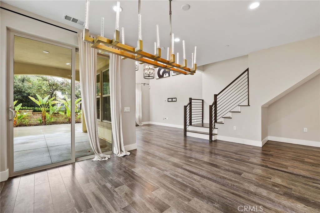 51 Prominence Lake Forest, CA 92630 - Photo 6 of 60 a view of an entryway with wooden floor and door