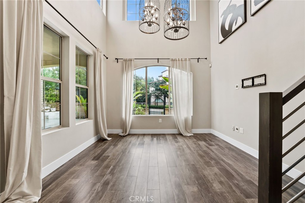 51 Prominence Lake Forest, CA 92630 - Photo 8 of 60 a view of a hallway with wooden floor and windows