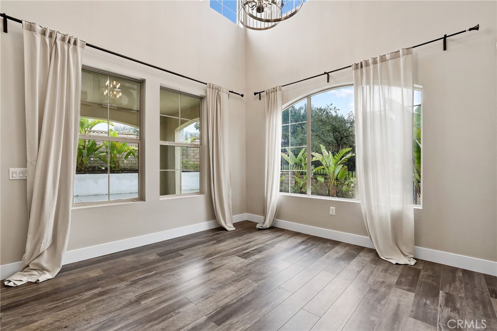 51 Prominence Lake Forest, CA 92630 - Photo 9 of 60 a view of an empty room with wooden floor and a window