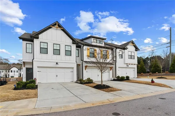 a view of a dining room with furniture and a large window