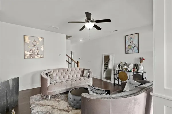 a spacious bedroom with a bed and a chandelier