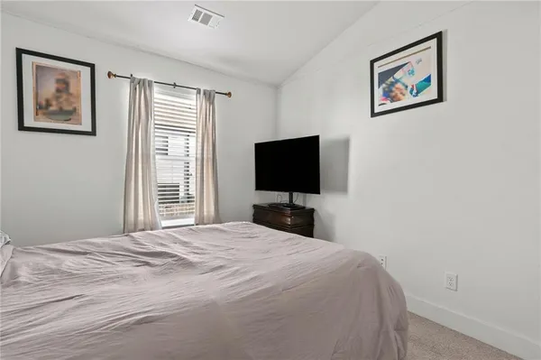 a view of a house with wooden fence