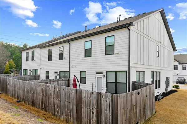 a front view of a house with a fence