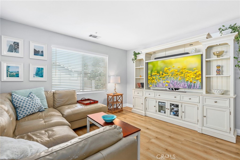 59 Red Bud Aliso Viejo, CA 92656 - Photo 13 of 34 a living room with furniture and a flat screen tv