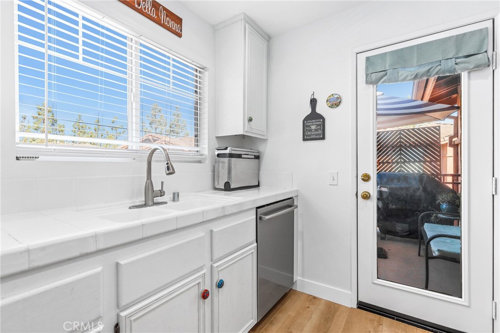 59 Red Bud Aliso Viejo, CA 92656 - Photo 18 of 34 a kitchen with a refrigerator and a sink