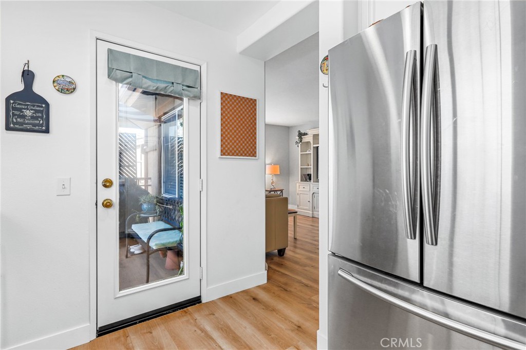 59 Red Bud Aliso Viejo, CA 92656 - Photo 19 of 34 a view of a hallway with wooden floor and a cabinet