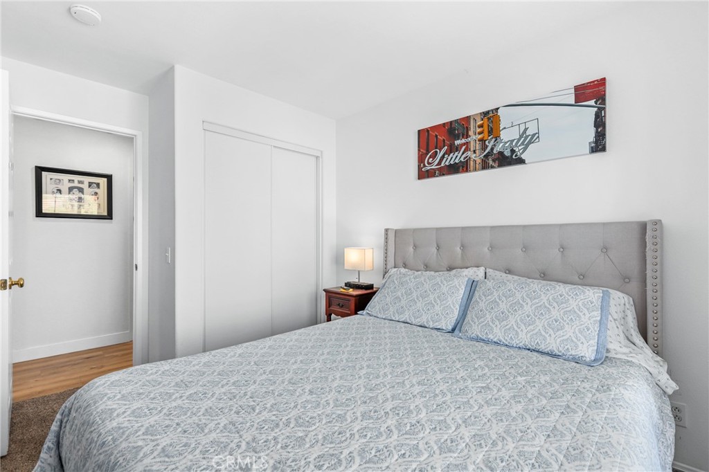 59 Red Bud Aliso Viejo, CA 92656 - Photo 21 of 34 a bedroom with a bed and a lamp