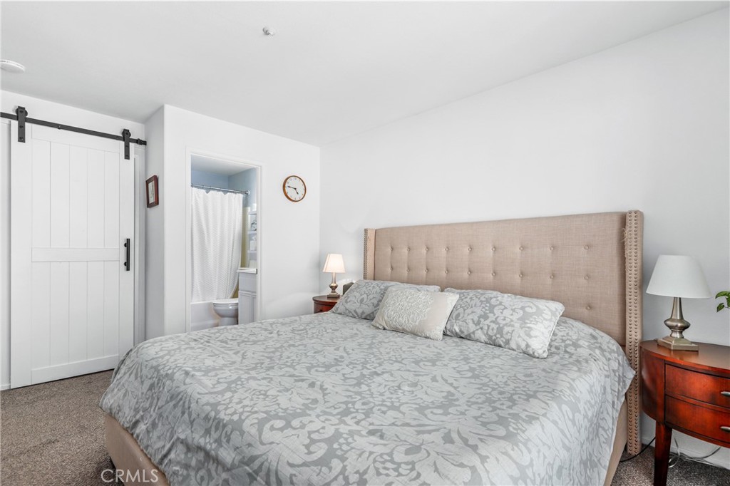 59 Red Bud Aliso Viejo, CA 92656 - Photo 24 of 34 a bedroom with a bed and a table