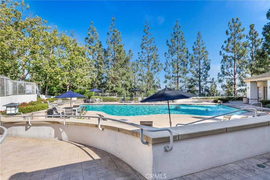59 Red Bud Aliso Viejo, CA 92656 - Photo 31 of 34 a swimming pool with outdoor seating and yard