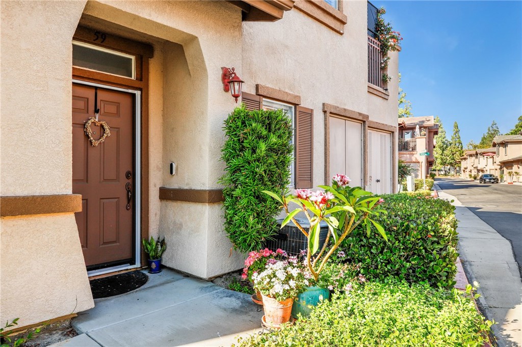 59 Red Bud Aliso Viejo, CA 92656 - Photo 5 of 34 front view of a house with potted plants