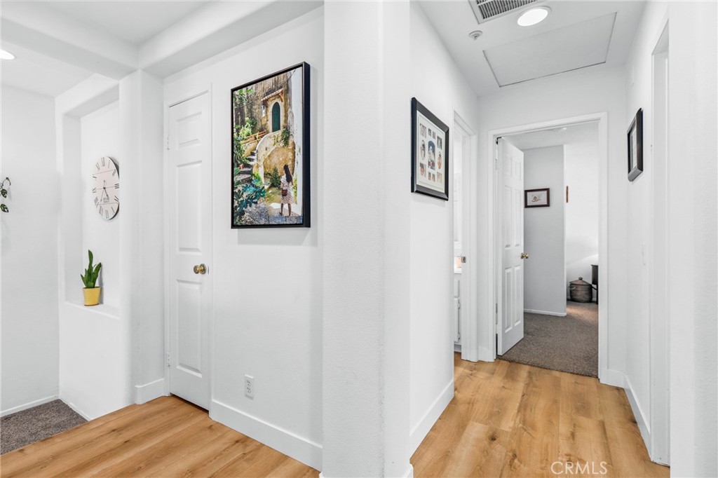 59 Red Bud Aliso Viejo, CA 92656 - Photo 8 of 34 a view of a hallway with wooden floor and closet