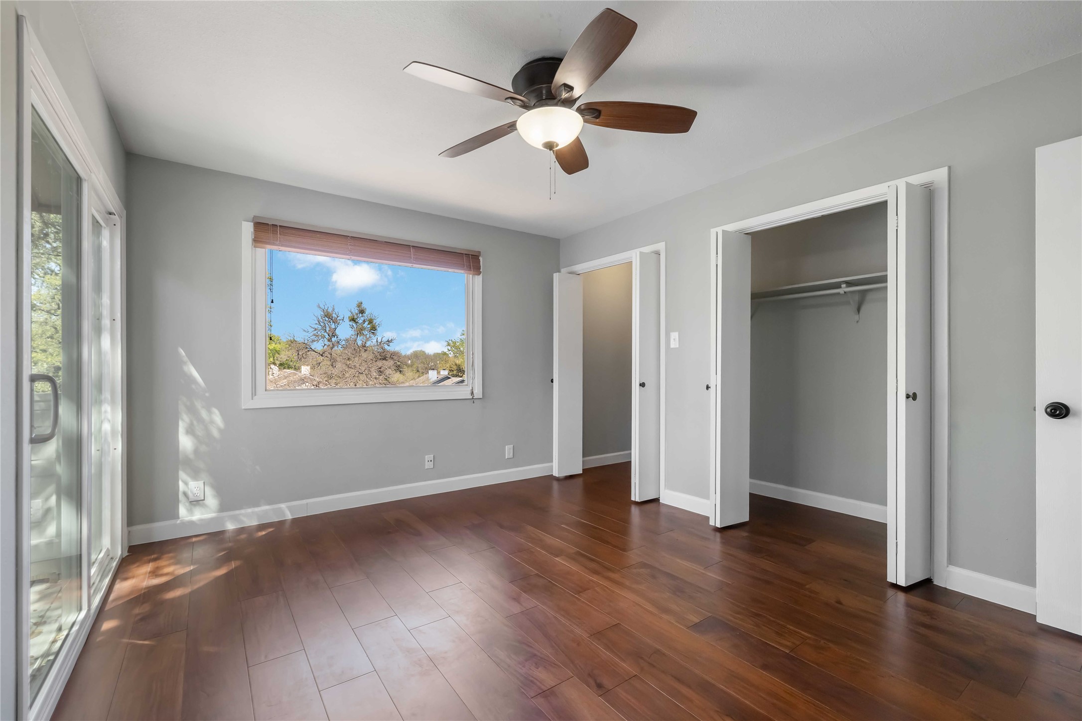 1703 Waterloo Trail, Unit B Austin, TX 78704 - Photo 17 of 36 Unfurnished bedroom featuring dark wood-type flooring and ceiling fan