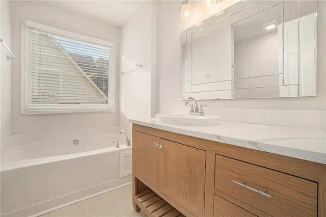 a bathroom with a sink and a bathtub