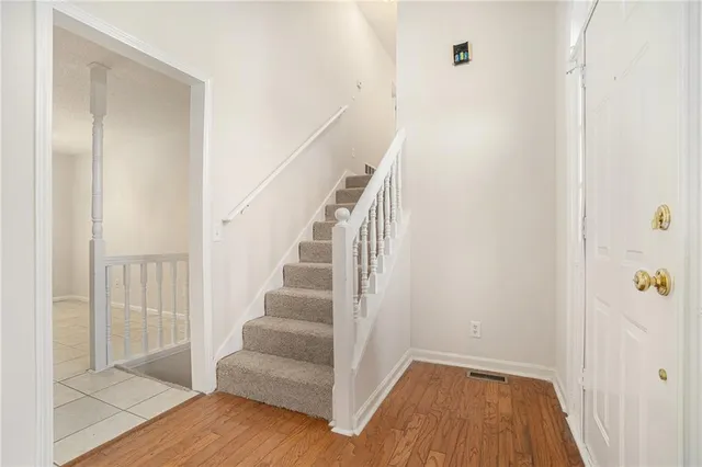 a view of entryway with wooden floor