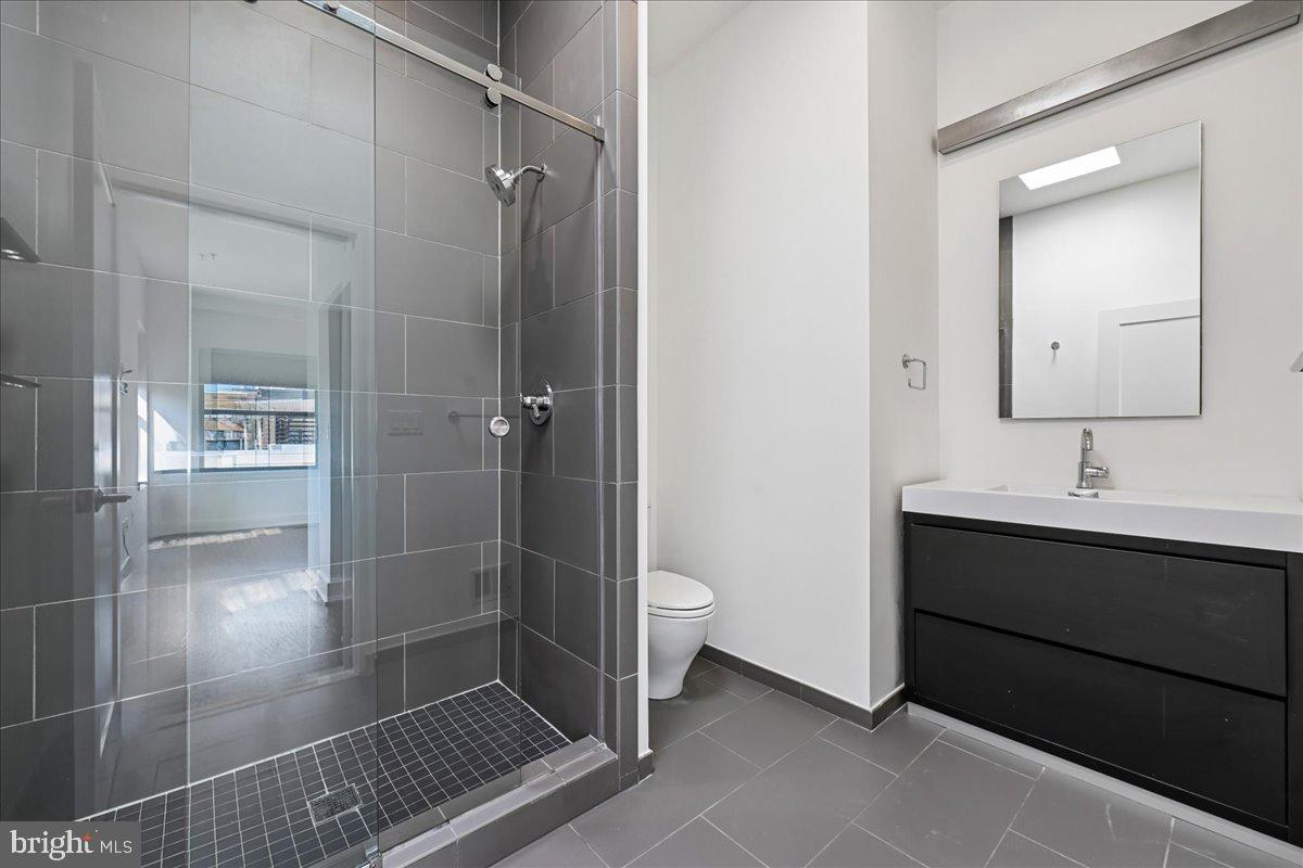 1111 W Street Northwest, Unit 12 Washington, DC 20009 - Photo 25 of 50 a bathroom with a shower and a sink