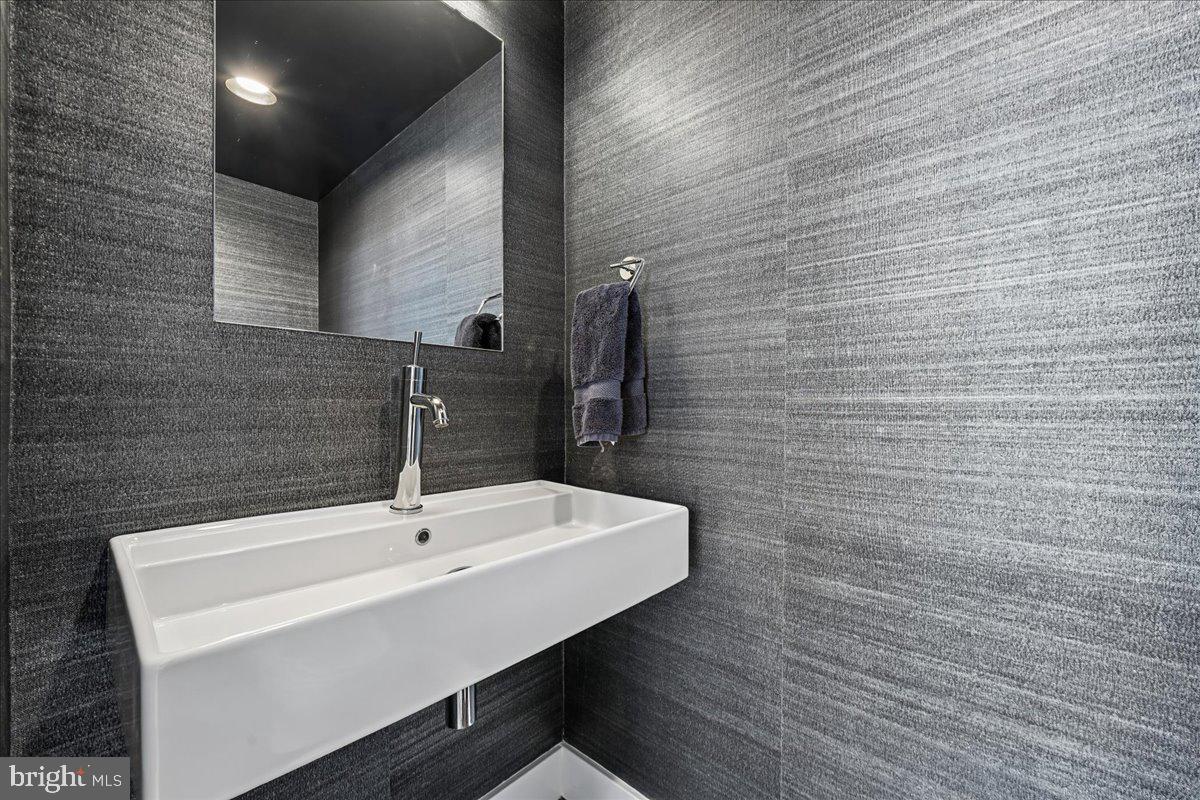 1111 W Street Northwest, Unit 12 Washington, DC 20009 - Photo 26 of 50 a bathroom with a sink and a mirror