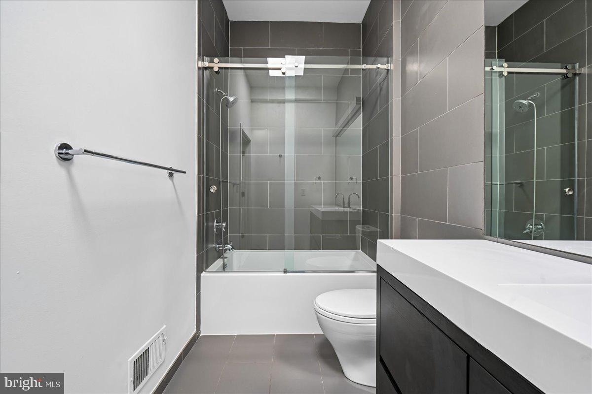 1111 W Street Northwest, Unit 12 Washington, DC 20009 - Photo 34 of 50 a bathroom with a bathtub and a shower