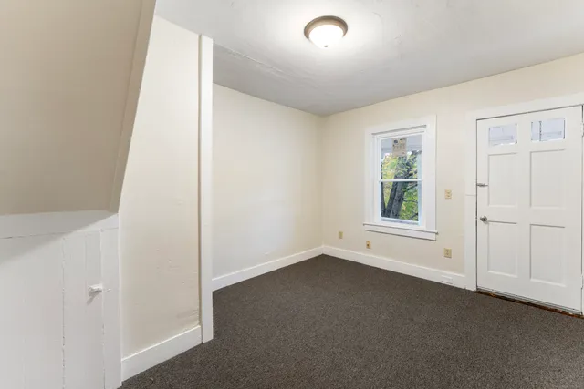 an empty room with stairs