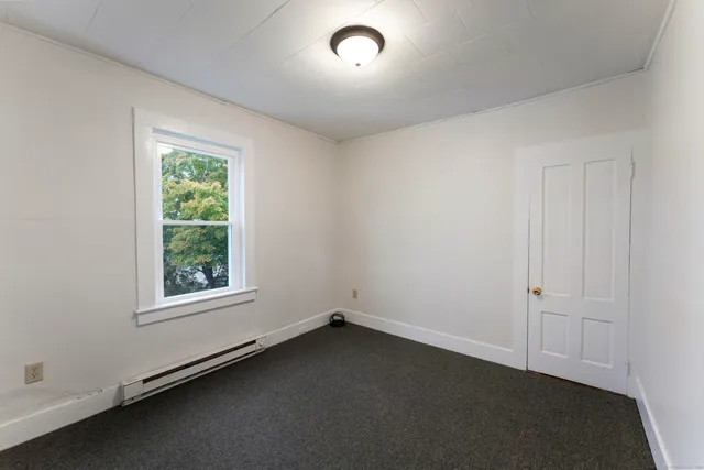 an empty room with a empty space and window