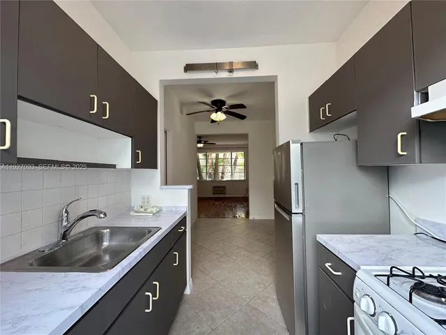 a view of a car parked in front of a house