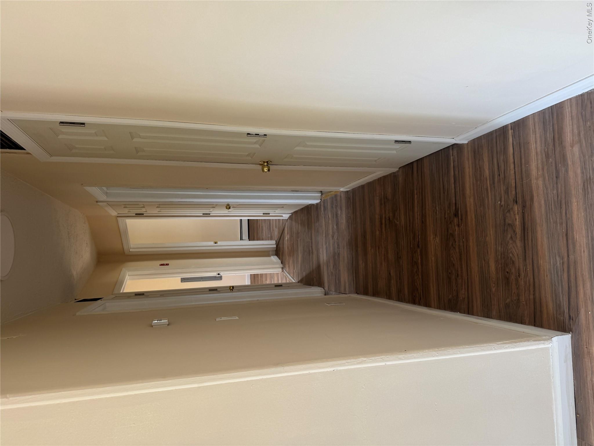 1 Pine Road Middle Island, NY 11953 - Photo 6 of 21 Corridor with baseboards and dark wood-style flooring