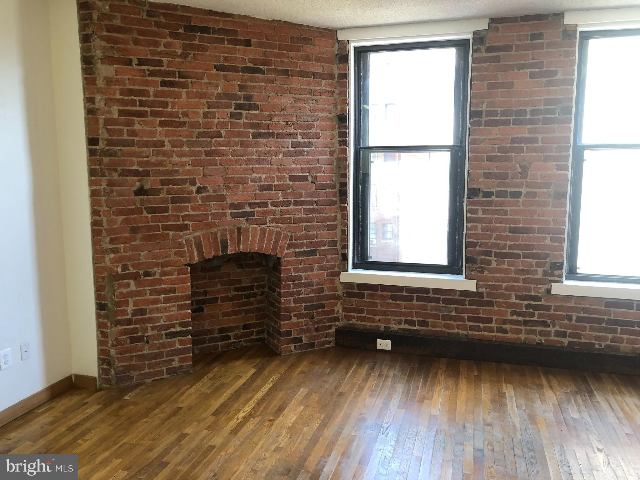 1615 Q Street Northwest, Unit 406 Washington, DC 20009 - Photo 9 of 21 Faux Brick Fireplace
