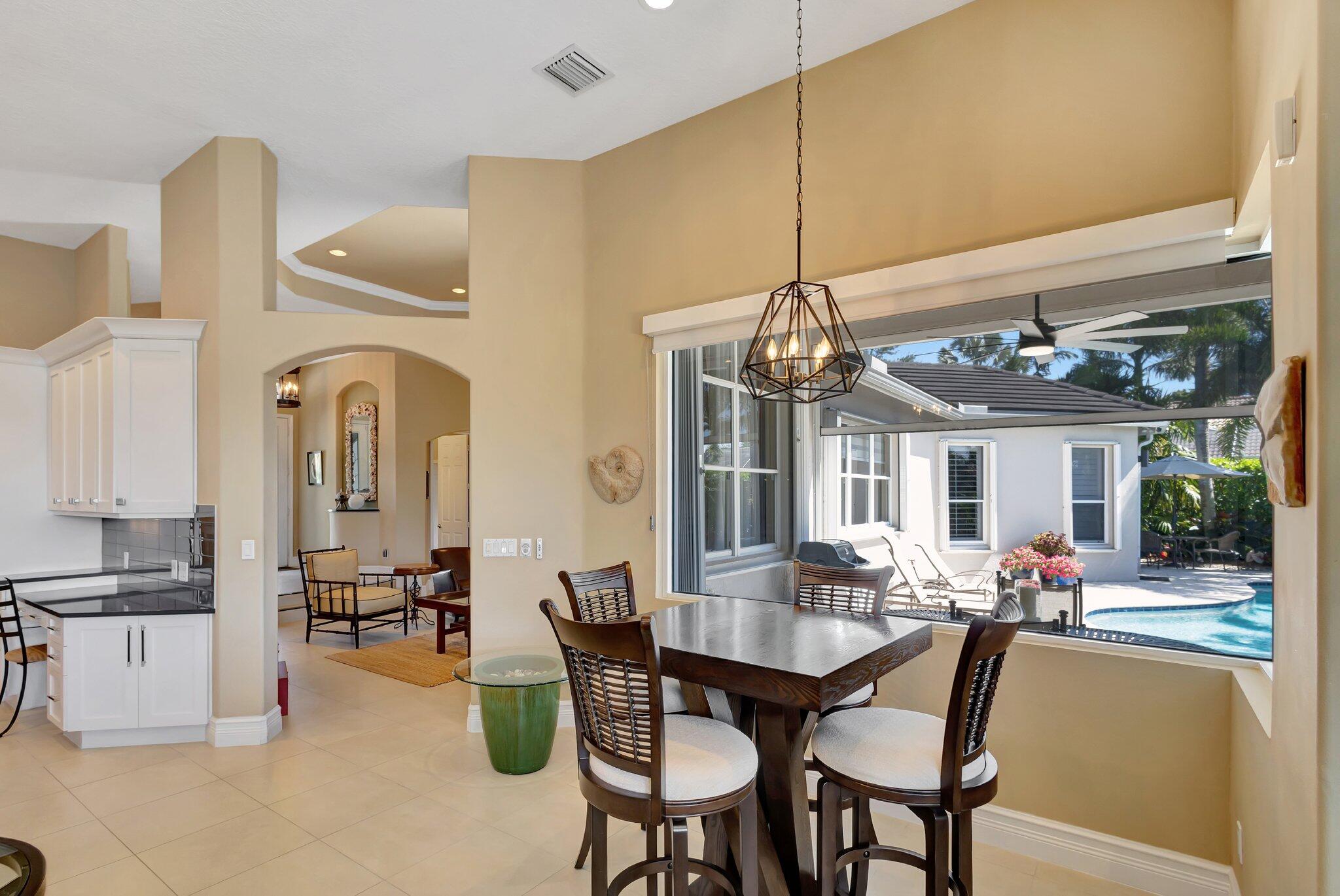 547 Robin Lane Jupiter, FL 33458 - Photo 17 of 78 Facing Pool and Lake