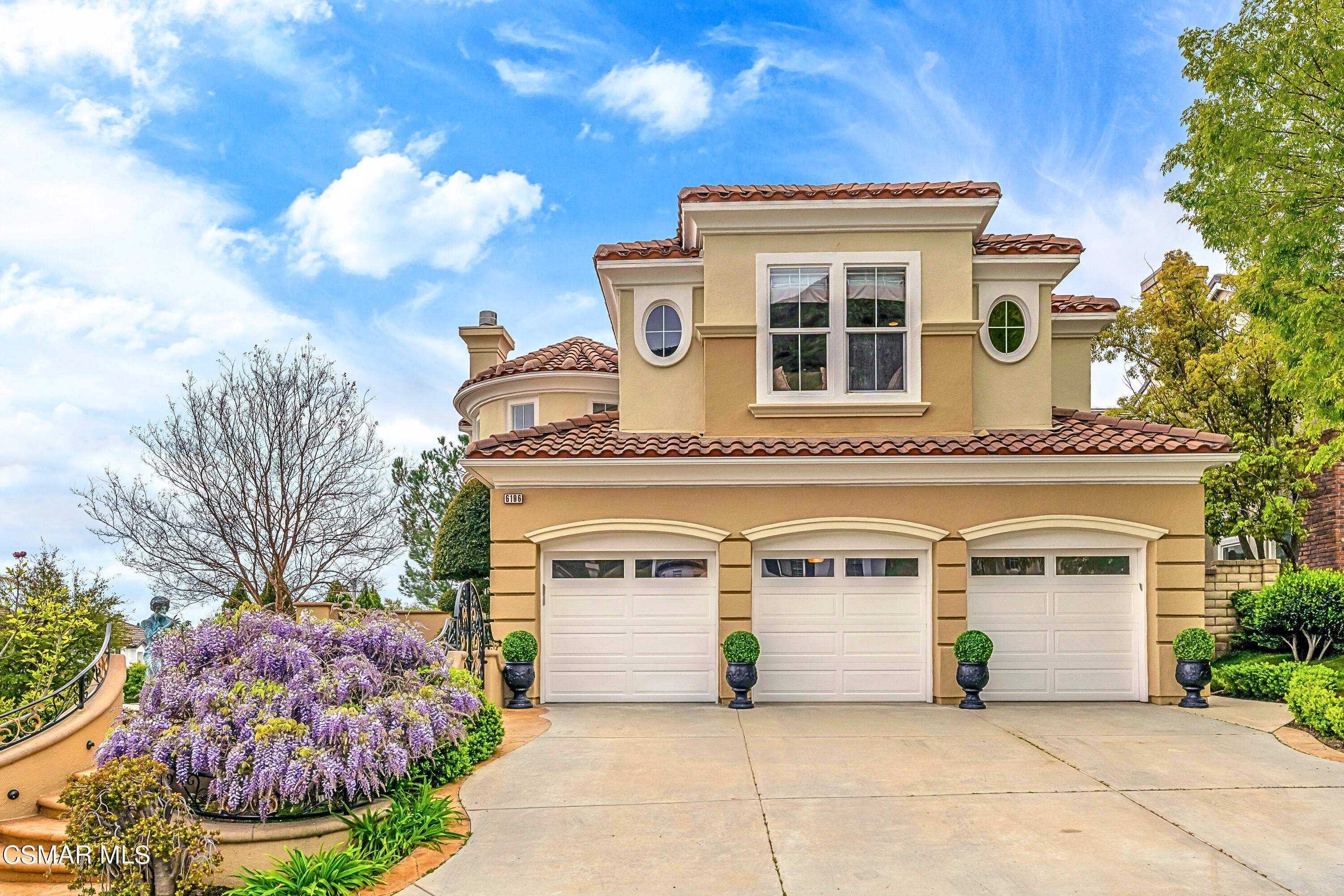 6196 Deerhill Road Oak Park, CA 91377 - Photo 1 of 46 a front view of a house with yard