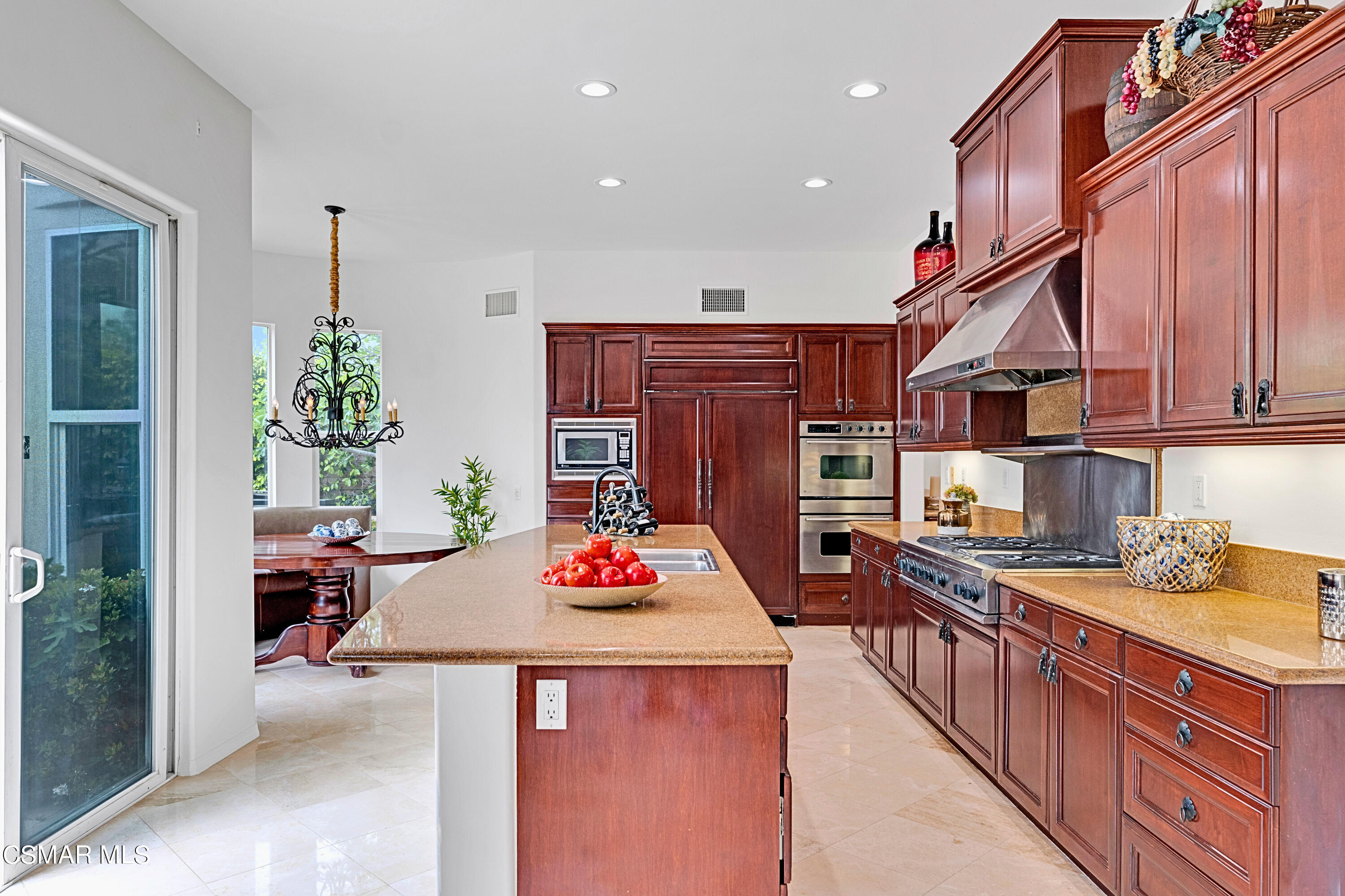 6196 Deerhill Road Oak Park, CA 91377 - Photo 17 of 46 a kitchen with stainless steel appliances granite countertop a sink stove and refrigerator