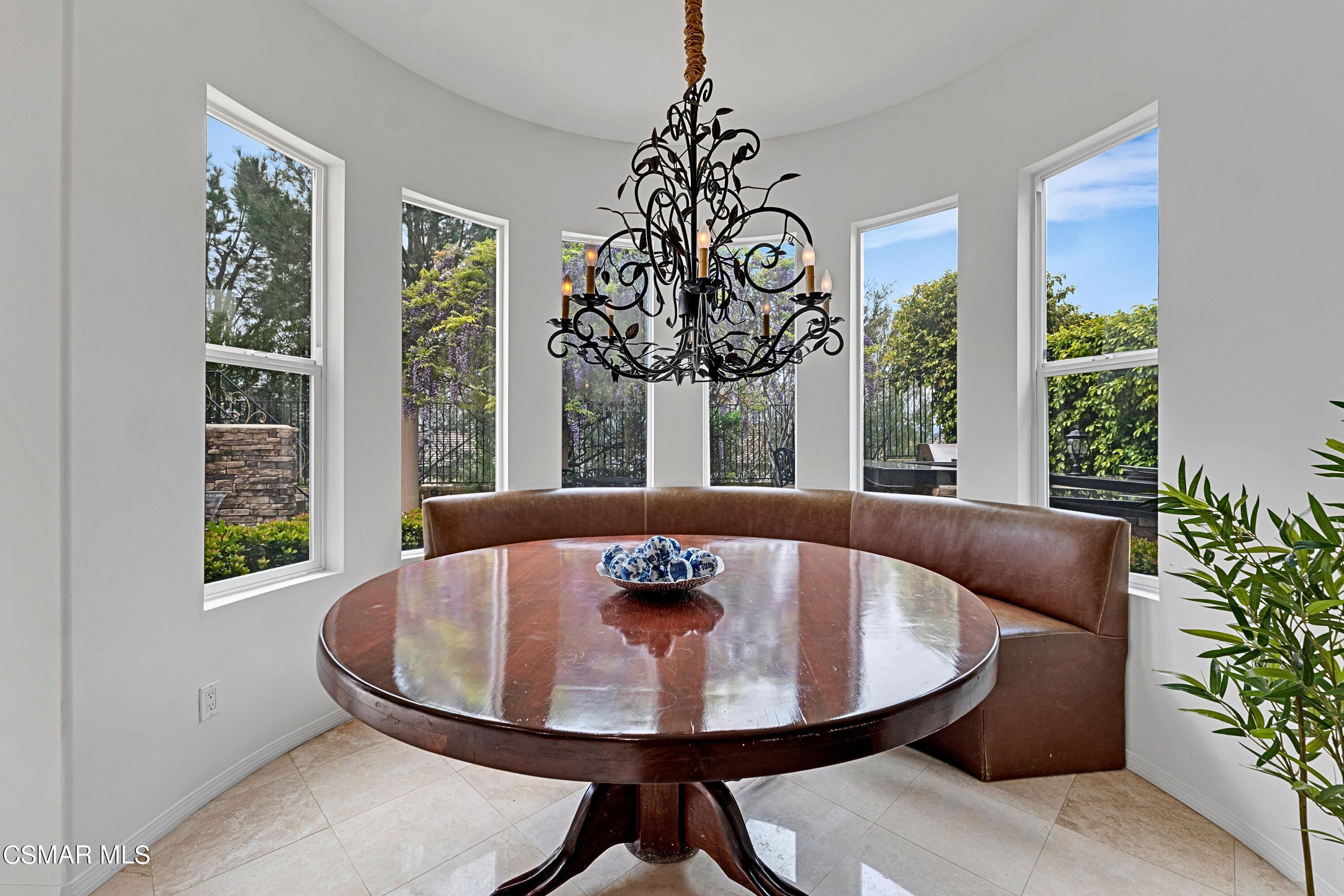 6196 Deerhill Road Oak Park, CA 91377 - Photo 18 of 46 a view of a dining room with furniture and window